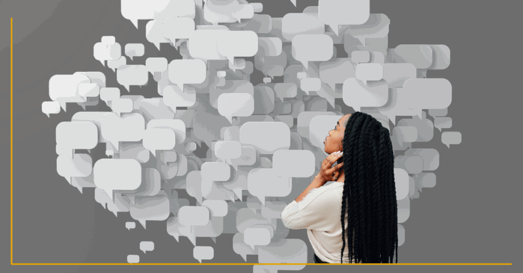 Image of Black femme person with long hair turned away from the viewer, facing a wall of blank word bubbles against a dark backdrop. A thin gold line runs through the image.