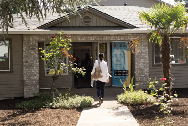 person walking toward the front entrance for the Magnolia House