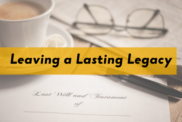 image of a desk featuring a will document and coffee and glasses. Text overlay highlighted yellow reads, "Leaving a Lasting Legacy"
