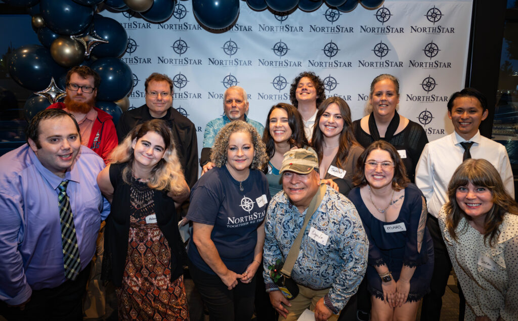 Matty poses with a group of NorthStar members and staff at the NorthStar gala