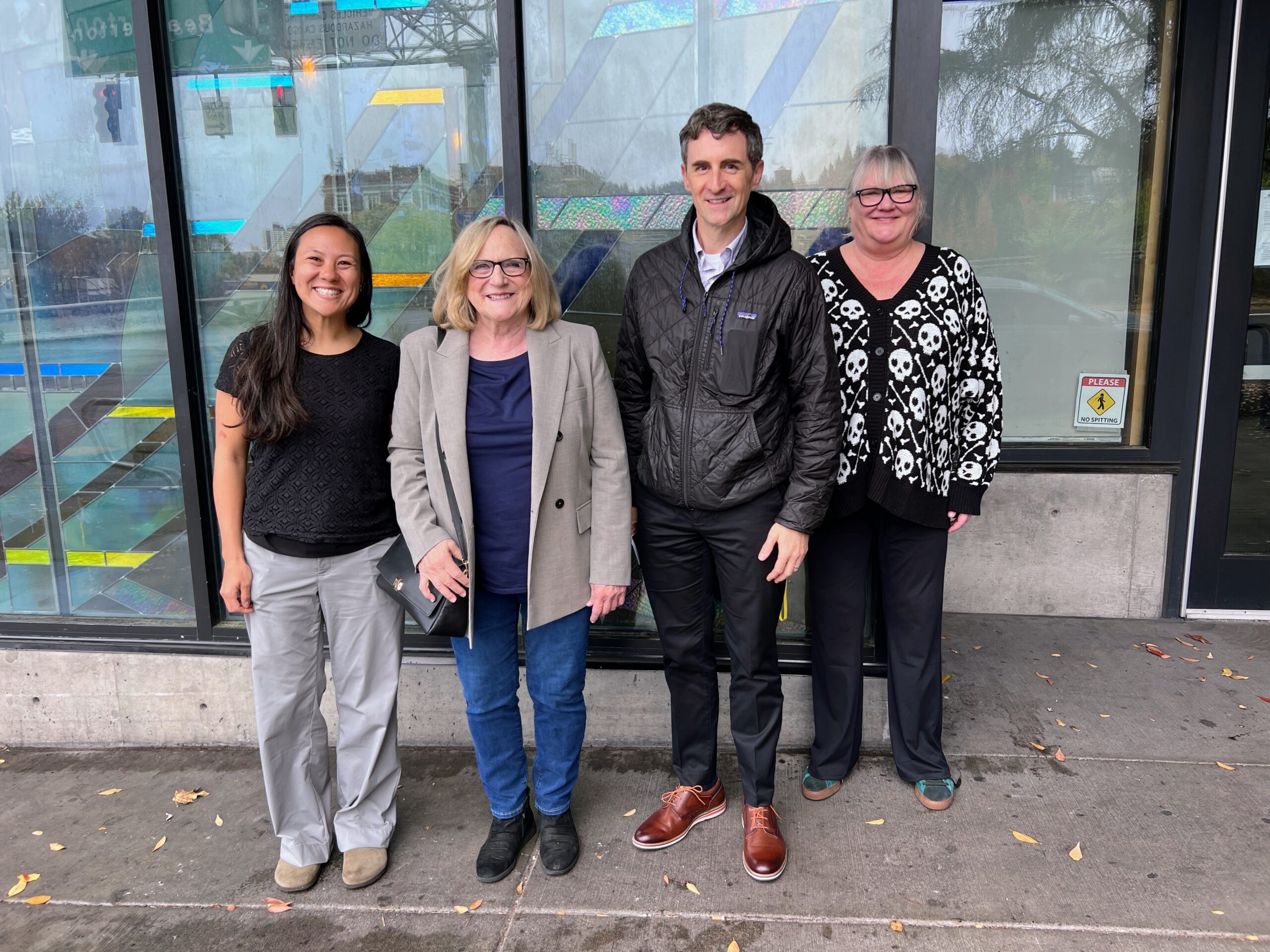 Four visitors stand outside Bridgeview during the October 9 Health Share visit.