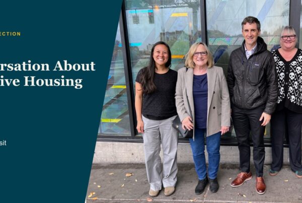 Four visitors stand outside Bridgeview during the October 9 Health Share visit, framed with teal and orange shapes.