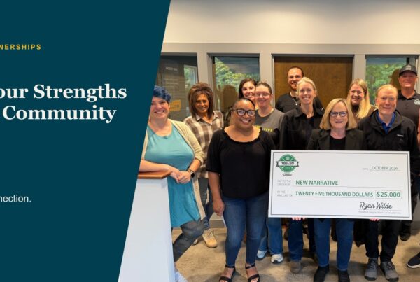 Community partners with a Walsh Construction presentation check for New Narrative, framed in the editorial design.